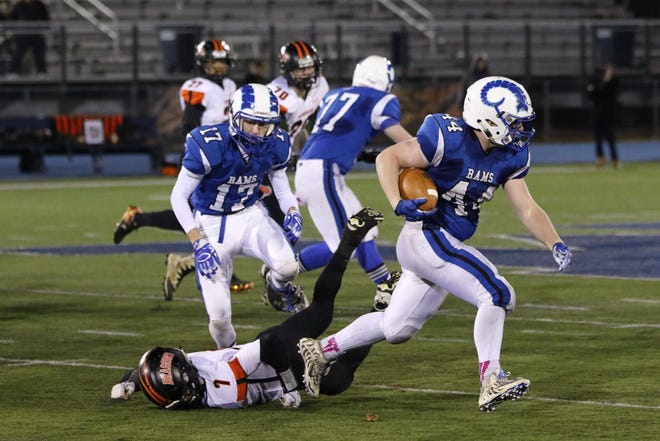 Photo by Jason Gendron

Kennebunk High running back Pat Saunders gets around Brunswick defender Jesse Devereaux and picks up some yardage during Friday's Class B state championship game. Blocking for Saunders is Justin Wiggins (17) and Brenna Schatzabel (77).