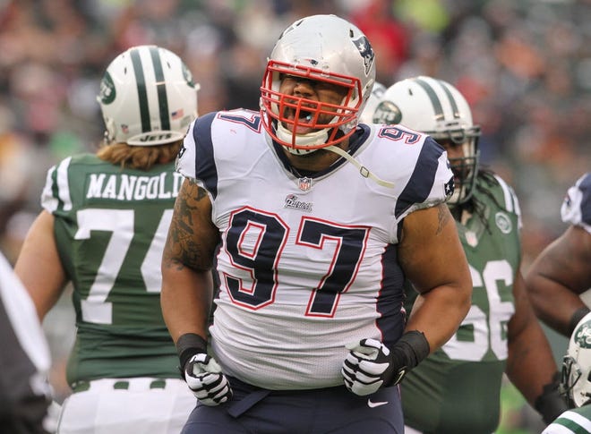 Alan Branch celebrates a key stop in a 2014 game against the Jets. After a slow start to his NFL career, Branch has found his groove with the Patriots.