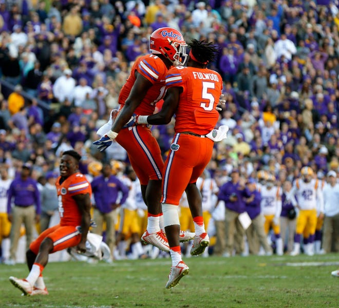 Florida wide receiver Ahmad Fulwood celebrates with teammates as time expires in the second half after the Gators held on fourth down against LSU. (Gerald Herbert/AP Photo)