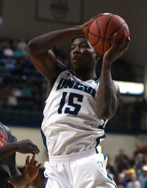 UNCW forward Devontae Cacok will have a tough battle against East Tennessee State's Hanner Mosquera-Perea in the post on Sunday. KEN BLEVINS/STARNEWS PHOTO