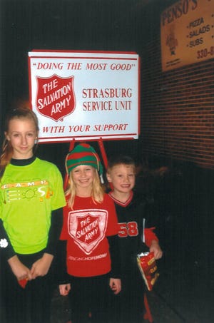Submitted photo

Taylor Starkey (L), Payton Starkey and Alex Starkey ringing the kettle bell for the Strasburg/Bolivar Salvation Army