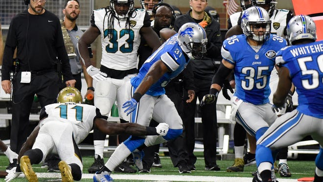 Detroit Lions strong safety Rafael Bush (31) runs an interception back for a 39-yard touchdown during the second half of an NFL football game against the Jacksonville Jaguars, Sunday, Nov. 20, 2016 in Detroit. (AP Photo/Jose Juarez)