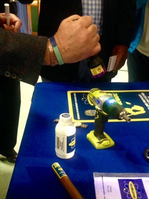 SmartWater CEO Phil Clearly demonstrates how the company's invisible liquid can track and identify stolen property. (Lynh Bui/The Washington Post)