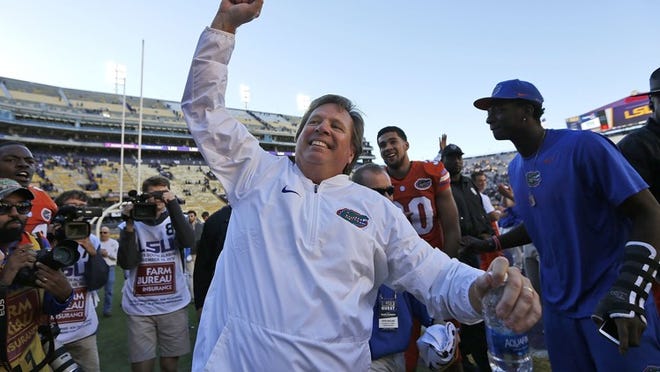 Florida coach Jim McElwain celebrates after the Gators held on to defeat LSU on Saturday in Baton Rouge, La. (Photo by Jonathan Bachman/Getty Images)