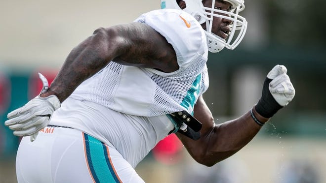 Miami Dolphins offensive tackle Laremy Tunsil (67) at Miami Dolphins training camp in Davie, Florida on August 9, 2016. (Allen Eyestone / The Palm Beach Post)