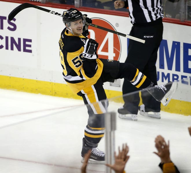 Penguins' Jake Guentzel (59) celebrates his second goal during the first period against the New York Rangers on Monday in Pittsburgh.