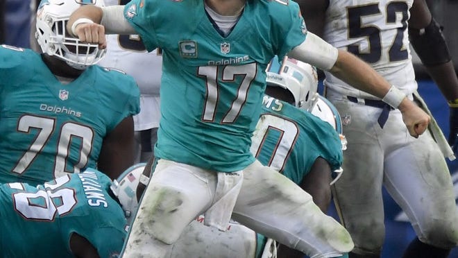Miami Dolphins quarterback Ryan Tannehill celebrates after their touchdown against the Los Angeles Rams during the second half of an NFL football game Sunday, Nov. 20, 2016, in Los Angeles. (AP Photo/Mark J. Terrill)