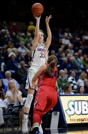 Connecticut's Katie Lou Samuelson shoots over Dayton's Lauren Cannatelli in the second half of an NCAA college basketball game, Tuesday, Nov. 22, 2016, in Storrs, Conn. (AP Photo/Jessica Hill)