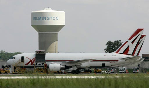 FILE - In this Thursday, June 5, 2008, file photo, two ABX Air cargo planes sit at Wilmington Air Park, in Wilmington, Ohio. Pilots for ABX Air, a cargo airline that carries packages for Amazon and DHL, went on strike Tuesday, Nov. 22, 2016, potentially causing delivery delays just as the holiday shopping season swings into high gear. (AP Photo/Al Behrman, File)