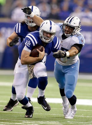 Indianapolis Colts quarterback Andrew Luck (12) is tackled by Tennessee Titans linebacker Aaron Wallace (52) during the first half of an NFL football game in Indianapolis, Sunday, Nov. 20, 2016. (AP Photo/Darron Cummings)