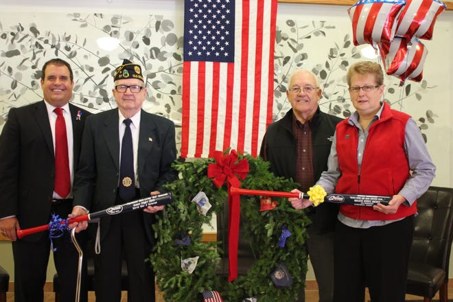 Left to right: KES Principal Ryan Quinn, WWII Honor Flight veteran Loring "Bob" Newcomb, Colin Quinn owner of Quinn Wood Bats, and Lil Charron, event coordinator for Wreaths Across America. 

Photo by Donna Buttarazzi/seacoastonline