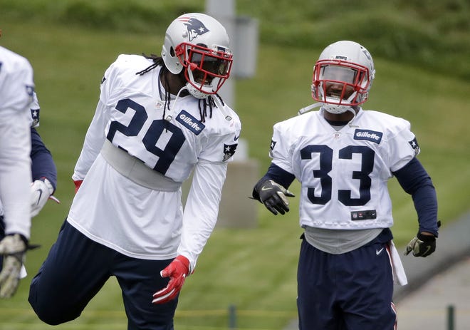 Patriots running backs LeGarrette Blount (29) and Dion Lewis talk during a recent practice in Foxborough, Mass. Lewis made his season debut on Sunday, adding another weapon to the backfield. AP Photo