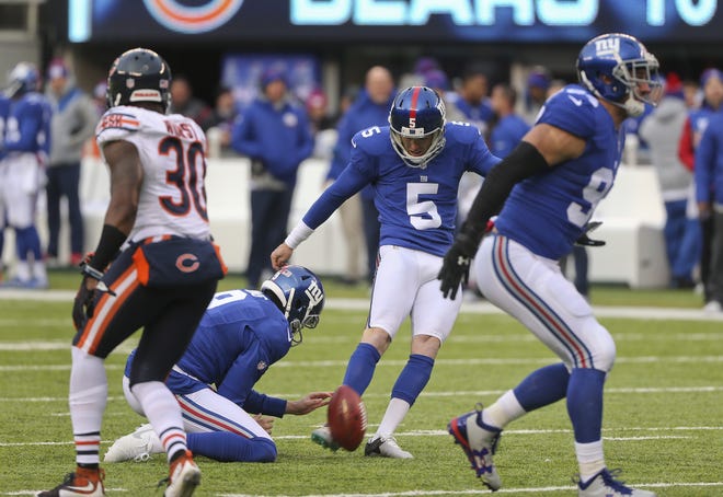 New York Giants kicker Robbie Gould (5) kicks an extra point against the Chicago Bears during the third quarter of a NFL game on Sunday in East Rutherford, N.J. Gould missed two extra points against his former team. (AP Photo/Seth Wenig)