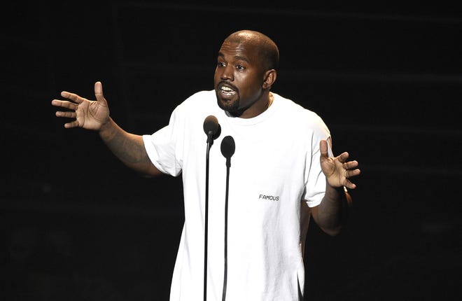 FILE - In this Aug. 28, 2016, file photo. Kanye West appears at the MTV Video Music Awards at Madison Square Garden in New York. At a Sacramento concert Saturday, Nov. 19, West told the audience he heard Beyonc‡© refused to perform at the MTV Video Music Awards unless she won Video of the Year over him, and also urged Jay Z to call him and not to send killers. (Photo by Chris Pizzello/Invision/AP, File)