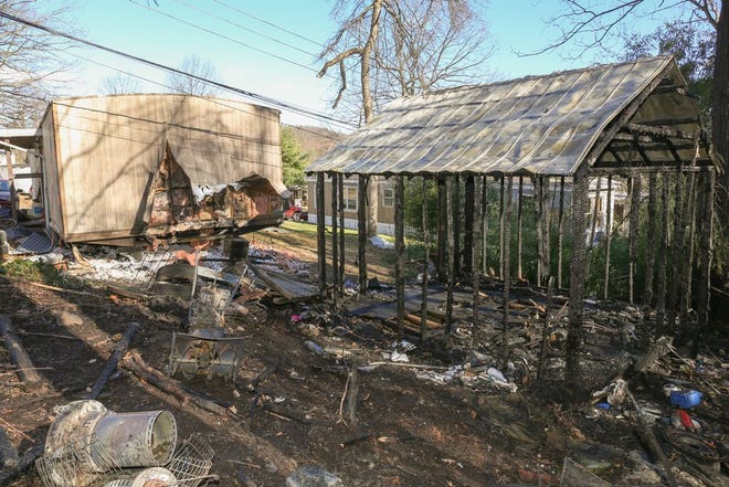 Shown is a storage shed and the outside of a residence at 14328 Buchanan Trail East in Blue Ridge Summit which caught fire early Monday morning.
