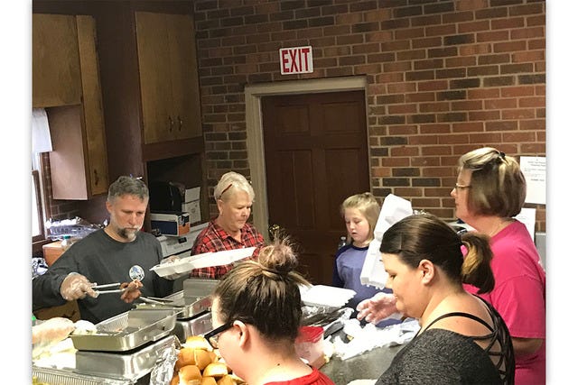 MEALS FROM THE HEART — Members of Brower’s Memorial Wesleyan Church fill takeout boxes with Thanksgiving meals. They are, clockwise from left, Alan Craven, Shelia Jackson, Kensley Fearnside, Heather Fearnside, Tanya Morris and Laney Morris. (Contributed photo)