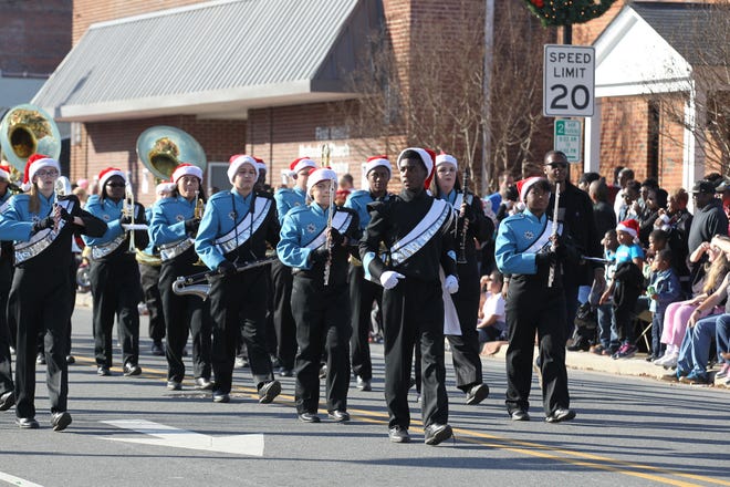 The Hunter Huss High School Band marches in last year's Christmas Parade in downtown Gastonia. PHOTO BY BRIAN MAYHEW.