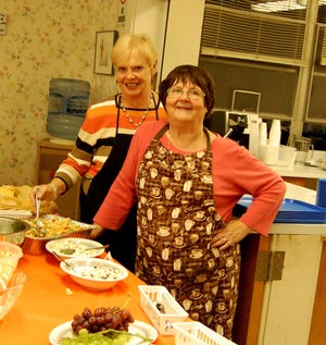 Jane Munson and Kathi Boyle serve during the GIG Giving Thanks Dinner held Nov. 17 at the Jonesville First Presbyterian Church. NANCY HASTINGS PHOTO