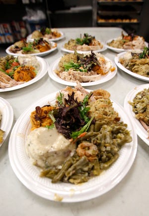 Thanksgiving dinner at the WestTown day shelter in Oklahoma City. [Photo By Steve Gooch, The Oklahoman]