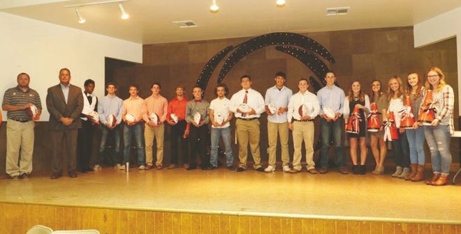 Senior members of the 2016 Pawhuska High School football team were recognized during the annual football dinner Pictured, left, is assistant coach Mark Frye, alongside the Huskies' coach, Joe Tillman. Next are senior players Ben Gray, Warren Graves, Tyler Wilson, Colton Hindman, Brycen Swan, Levi Youngwolfe, Daneal Parks, John Bighorse, Eli Redeagle, Caleb Bruce and Nathan Richardson. The five seniors of Pawhuska's cheer squad are, from right, are Riley Sell, Samantha Lookout, Madelyn Priest, Heather Conner and Laurel Culver.

Jack Buzbee/J-C correspondent