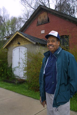 Walter Washington in front of the Little Bethel African Methodist Episcopal Church on Third Street, Stroudsburg, Monday, April 22, 2002. This historical church was completed in 1865, just after emancipation. Washington was president of a group intent on restoring the church and turning it into a black history museum. (David W. Coulter/Pocono Record)