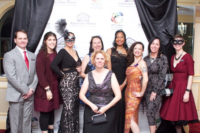 Sojourner House's board of directors, from left: Bruce Medeiros, Kathy Souza, Sandy Furtado, Christine McDermott, Tara Costello, Jessa Goldstein, Jeanne Peck, Stephanie Huckel, and Julie Steffes is in front. The Sojourner House's 6th annual Masquerade Ball fundraiser held Friday, Nov. 18, at the Providence Biltmore.



Photo by Ryan Gilman