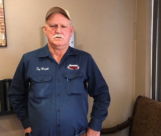 In a photo taken Nov. 15, 2016, Foy Wright stands in the lobby of his collision repair business in Littlefield, Texas. Wright said he'd like President-elect Donald Trump to loosen regulations on oil and gas production, which he call his "bread and butter" at his second location in Levelland. The oil and gas industry is a major employer in Levelland. (AP Photo/Betsy Blaney)