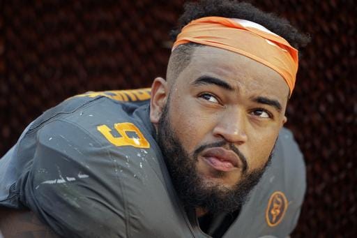 FILE - In this Sept. 24, 2016, file photo, Tennessee defensive end Derek Barnett (9) watches from the sideline during the second half of an NCAA college football game against Florida, in Knoxville, Tenn. Barnett returns to his hometown with a chance to pass Reggie White for the school's career sacks record when the 24th-ranked Volunteers visit Vanderbilt. (AP Photo/Wade Payne, File)