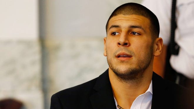 Aaron Hernandez sits in the courtroom of the Attleboro District Court during his hearing on August 22, 2013 in North Attleboro, Mass. (Photo by Jared Wickerham/Getty Images)