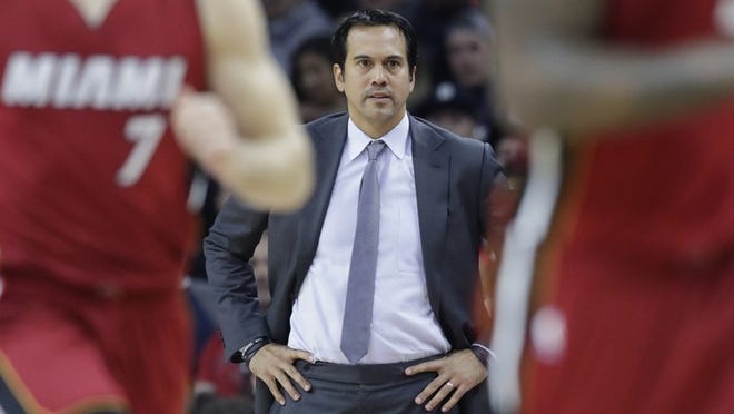 Miami Heat head coach Erik Spoelstra watches from the sideline during the first half of an NBA basketball game against the Detroit Pistons, Wednesday, Nov. 23, 2016 in Auburn Hills, Mich. (AP Photo/Carlos Osorio)