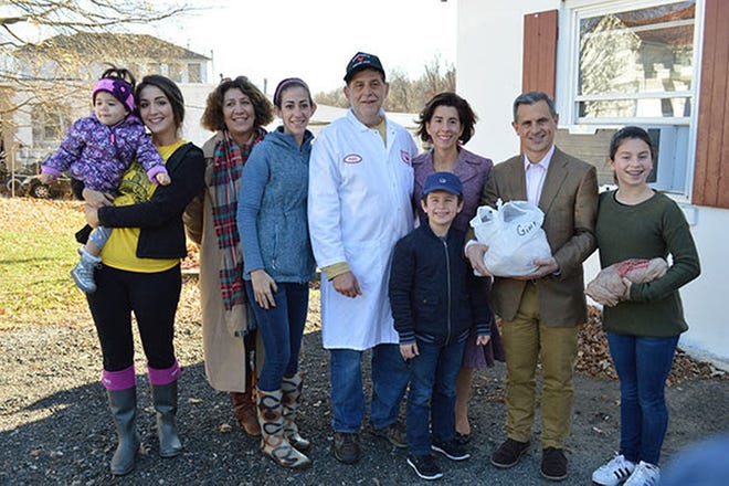Governor Gina Raimondo and her family pose at Baffoni's Poultry Farm.