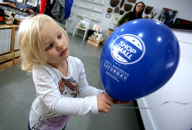 Brittany Randolph/The StarHarper Smith, 3, plays with a Small Business Saturday balloon while visiting Fadales in uptown Shelby.