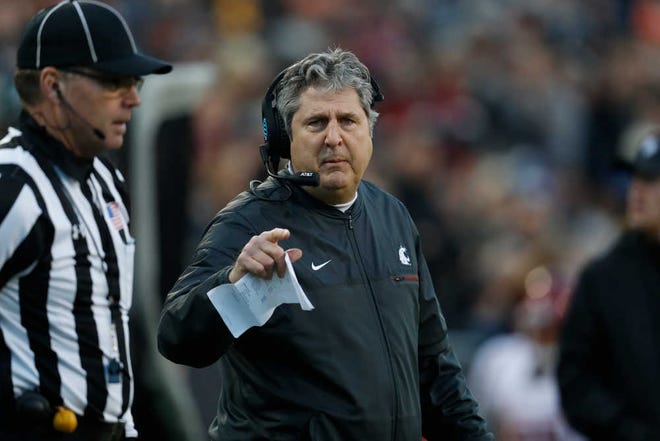 Washington State Cougars head coach Mike Leach and his team play Washington on Friday for a spot in the Pac-12 championship game.