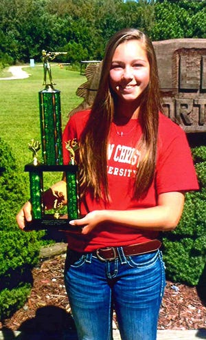 Maggie Anderson poses with the trophy she won for 1st place. Photos submitted