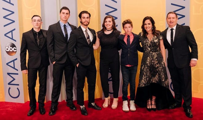 Country singer and songwriter and lifelong Stoughton resident Lori McKenna with her family at the Country Music Association Awards in Nashville, Tennesee Nov. 2, 2016. McKenna won the Song of the Year award for writing 'Humble and Kind' performed by Tim McGrath. Photo courtesy of Becky Fluke.