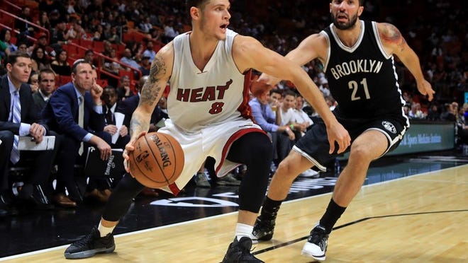 MIAMI, FL - OCTOBER 11: Tyler Johnson #8 of the Miami Heat drives on Greivis Vasquez #21 of the Brooklyn Nets during a preseason game at American Airlines Arena on October 11, 2016 in Miami, Florida. NOTE TO USER: User expressly acknowledges and agrees that, by downloading and or using this photograph, User is consenting to the terms and conditions of the Getty Images License Agreement. (Photo by Mike Ehrmann/Getty Images)