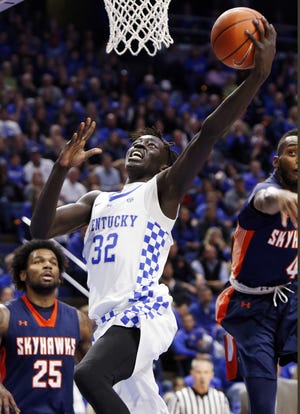Kentucky forward Wenyen Gabriel, center, scored 15 points and top-ranked Kentucky routed UT-Martin, 111-76, on Friday. THE ASSOCIATED PRESS