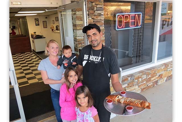 NEW OWNERS —Melanie and Steve Hlili, along with their children, Aliyia, Breana and Stephan, welcome people to their new place to eat, the Primavera Italian Restaurant in Seagrove. (Greta Lint / The Courier-Tribune)