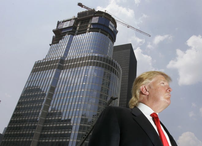 FILE - In this May 24, 2007, file photo, Donald Trump is profiled against his then-under construction 92-story Trump International Hotel & Tower in Chicago. Trump's hands-on, minutiae-obsessed management style will be tested by the presidency, a job in which his predecessor says that only the biggest and most difficult decisions even make the president's desk. (AP Photo/Charles Rex Arbogast, File)