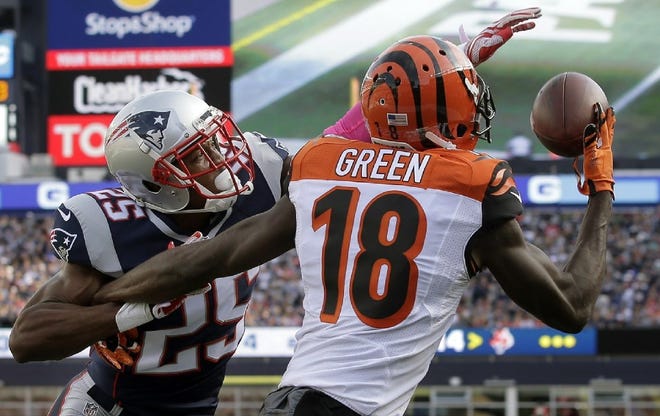 Patriots corner Eric Rowe, left, reaches in to break up a pass to Bengals wide receiver A.J. Green in the end zone during their Oct. 16 game in Foxboro.