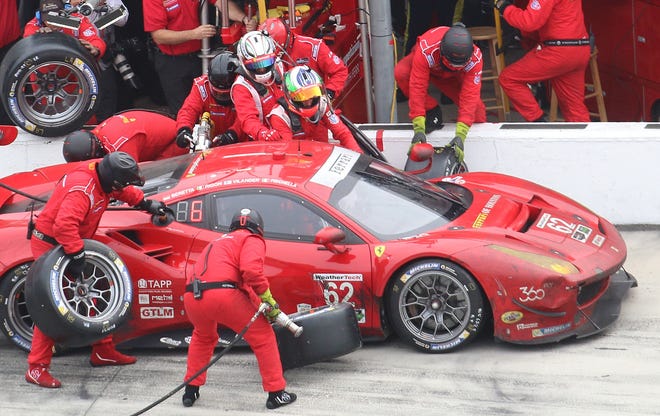 The No. 62 Risi Competizione Ferrari gets some attention in the pits during the late stages of the 2016 Rolex 24. Ferrari's presence here will increase exponantially when the Ferrari World Championship comes to Daytona Intenational Speedway later this week. NEWS-JOURNAL/JIM TILLER