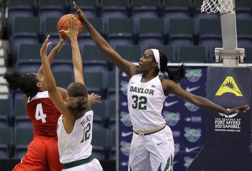 Baylor's Beatrice Mompremier (32) blocks a shot by Ohio State's Sierra Calhoun (4) as Baylor's Alexis Prince (12) defends during the first half of an NCAA college basketball game at the Gulf Coast Showcase basketball tournament Sunday, Nov. 27, 2016, in Estero, Fla. (AP Photo/Luis M. Alvarez)