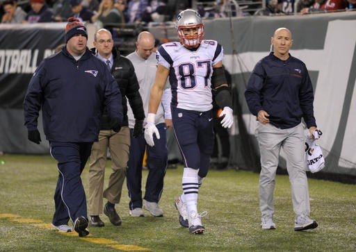 New England Patriots tight end Rob Gronkowski (87) walks off the field with an injury during the second quarter of an NFL football game against the New York Jets, Sunday, Nov. 27, 2016, in East Rutherford, N.J. (AP Photo/Bill Kostroun)