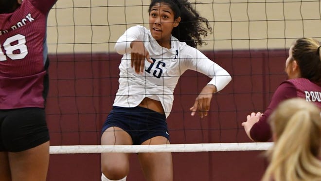 Bryana Hunter follows through on a spike for Hendrickson in a district volleyball match earlier this season. Henry Huey for Round Rock Leader.