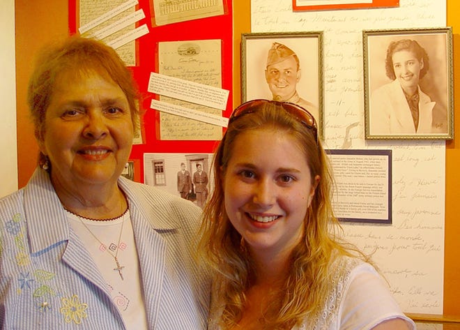 Elaine Holland, daughter of World War II soldier Wildré Pelletier of South Berwick, stands with her granddaughter, Jessica Prentiss. Pelletier’s photos, letters and memorabilia are part of a display by the Old Berwick Historical Society at South Berwick Public Library. In Pelletier’s childhood, his family spoke French, as his parents had immigrated from Quebec. He attended St. Michael’s Church, which later became the home of the library, and attended parochial school in what is now South Berwick Town Hall. Courtesy photo