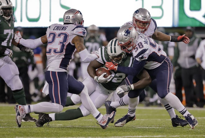 Patriots outside linebacker Shea McClellin, right, tackles New York Jets running back Matt Forte during Sunday's game in East Rutherford, N.J. The Associated Press
