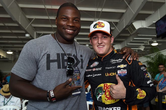 Fayetteville native and Colts tight end Dwayne Allen, left, hangs out with Ty Dillon during qualifying for the NASCAR Xfinity Series race at Indianapolis Motor Speedway in 2015.