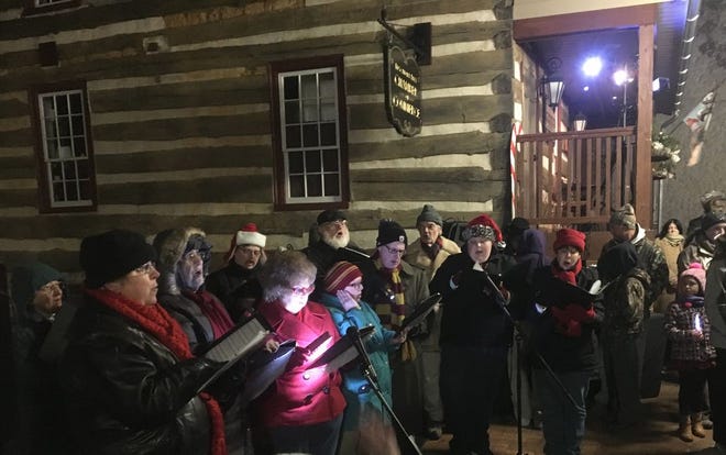 A choral ensemble with members from area churches performed during Mercersburg's tree-lighting ceremony Saturday.