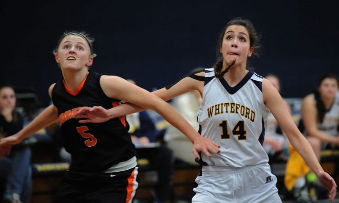 Summerfield's Erin Manley (left) and Anna Thornton of Whiteford battle for a rebounding position during a game last season. (Monroe News photo by TOM HAWLEY)