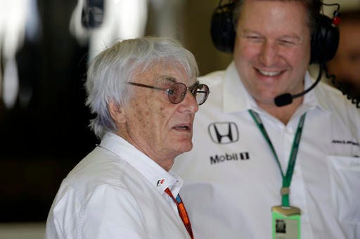 Formula One boss Bernie Ecclestone stops at the McLaren team box during the first free practice at the Yas Marina racetrack in Abu Dhabi, United Arab Emirates, Friday, Nov. 25, 2016. The Emirates Formula One Grand Prix will take place on Sunday. (AP Photo/Luca Bruno)
